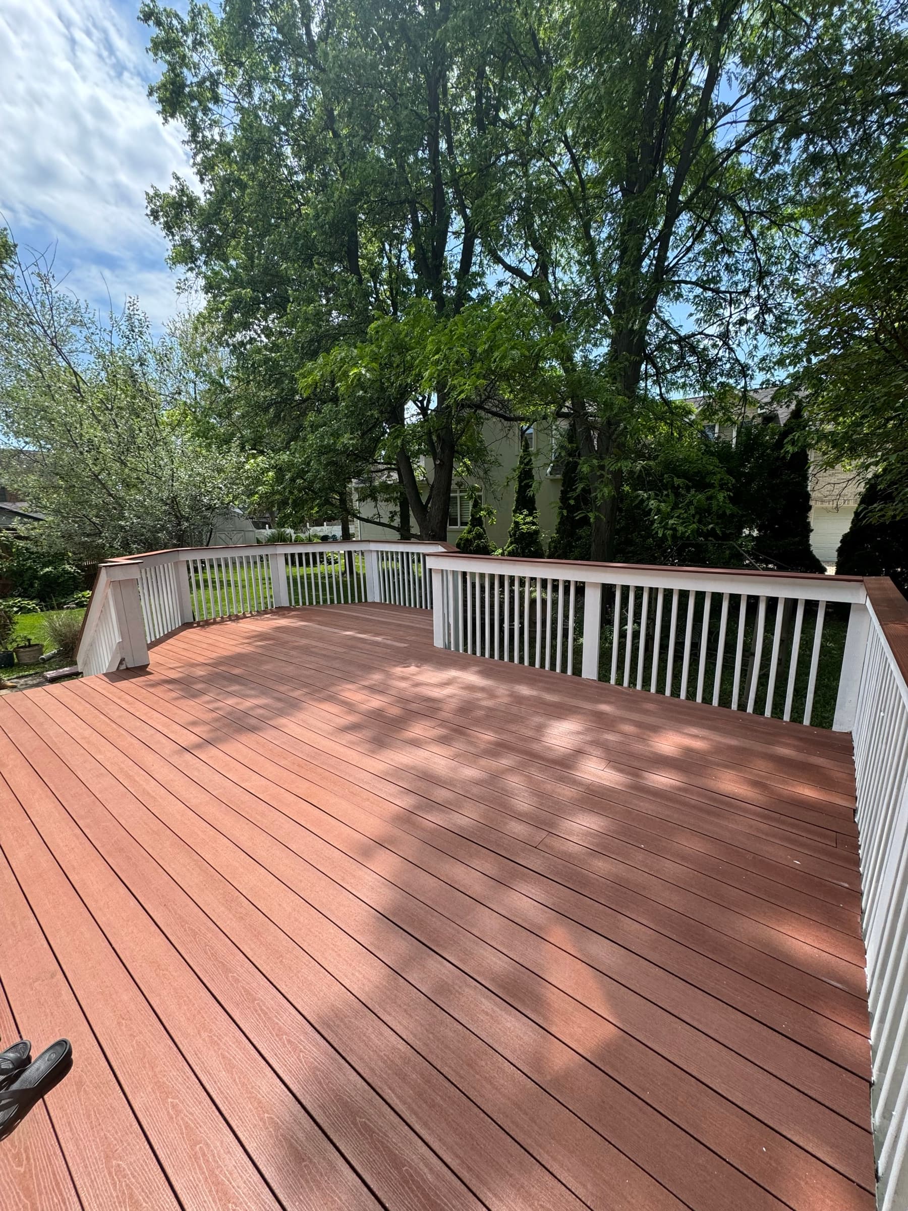 The finished deck from the opposite corner in dappled afternoon sun